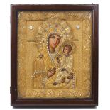 A Russian icon, 20th Century, depicting the Virgin Hodegetria, with a gilt woven embroidered and