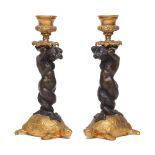 A Pair of candlesticks, 19th Century, in the Louis XV style, each one modelled as Melusine, the