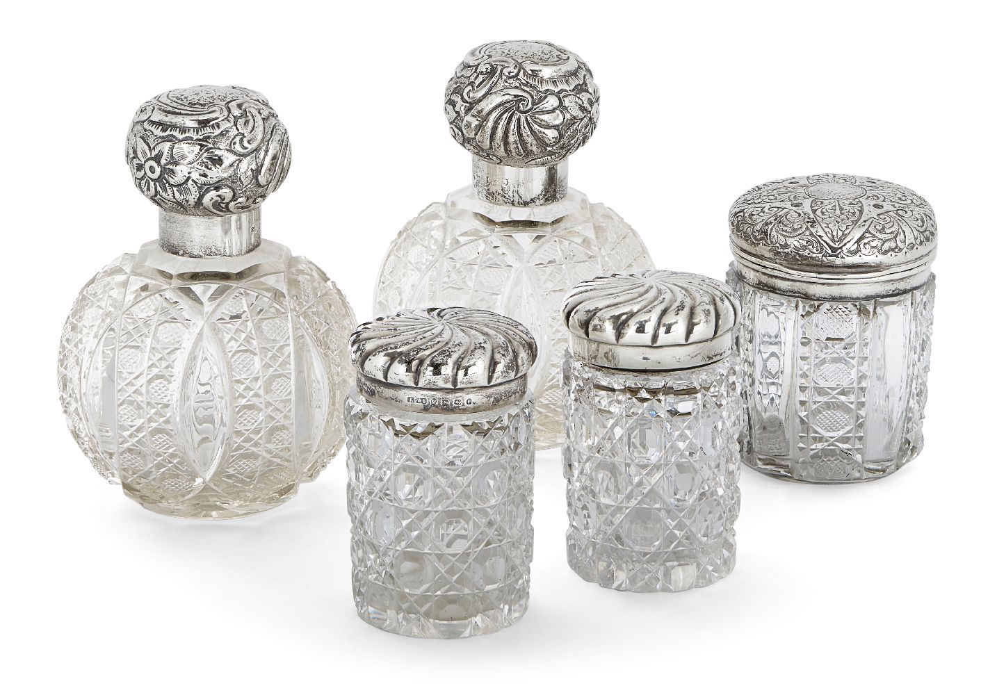 Five silver mounted glass vanity vessels, including: a pair of globular cut glass examples,