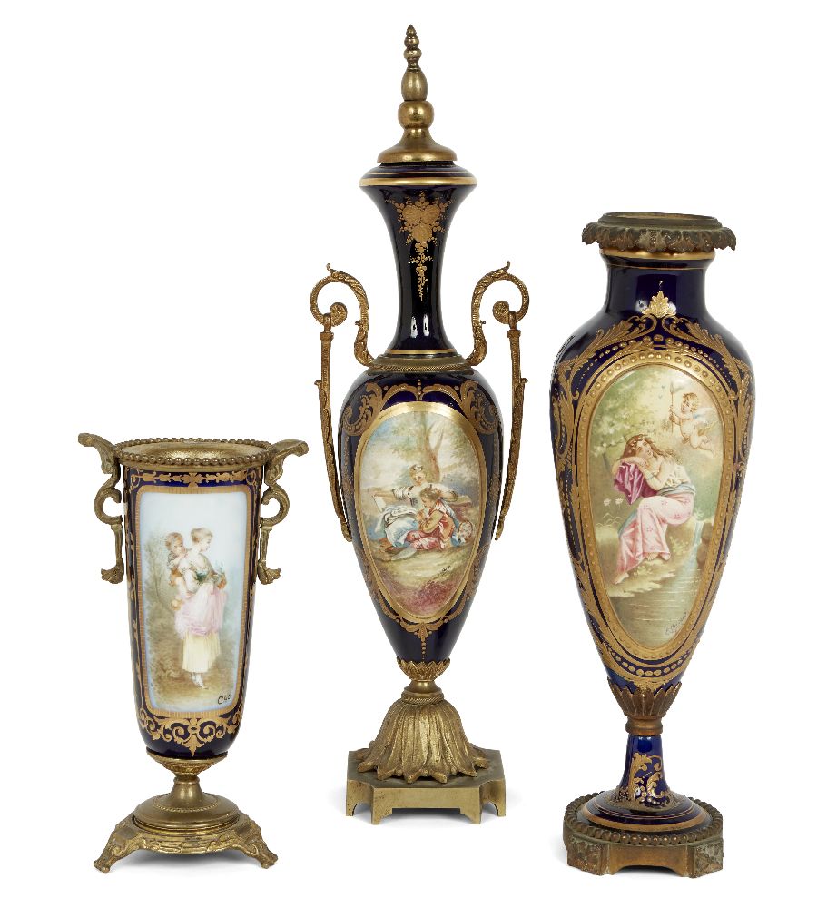 Three French Sevres style porcelain gilt-metal mounted vases, circa 1900, each painted with panels