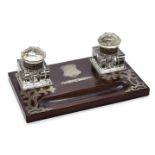 An Edwardian silver mounted wooden inkstand, London, c.1903, M Chapman, Son & Co Ltd., the two