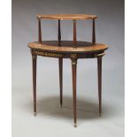 A Louis XVI mahogany and gilt metal mounted two tier occasional table, with two graduated oval