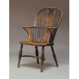 An early 19th Century ash and elm seated Windsor armchair, circa 1820, probably attributable to