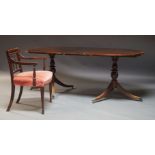 A George III style mahogany D-end extending dining table, the crossbanded top, with one additional