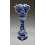 A Victorian jardinière and stand, in blue colour way with an internal pink glaze, 115cm high;