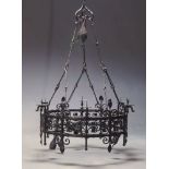 A large French wrought iron six light ceiling light, of circular form with six candles sconces and