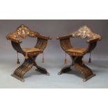 A pair of Italian Florentine late 19th Century rosewood X-framed chairs, the crest rails with