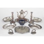 A small quantity of silver plate comprising: a pair of entrée dishes; a bread board with wooden