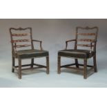 A pair of George III and later carved open armchairs, circa 1770, in the manner of Thomas