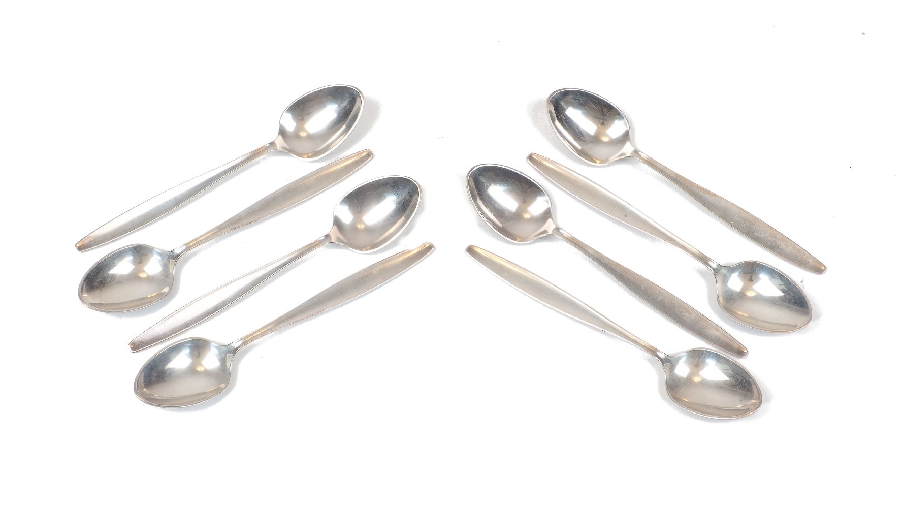 A set of eight Georg Jensen silver teaspoons, stamped sterling, Denmark, total weight approx. 4.