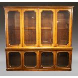 A late 19th Century walnut two-tier glazed bookcase, circa 1870, the upper section with a