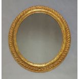 A 19th Century gilt framed oval mirror, with gadroon moulded edges to frame, having a single plain