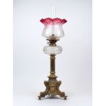 A Victorian Hinks & Son brass table oil lamp, designed with pierced gallery atop a clear moulded