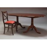 A George III style mahogany twin pedestal D-end dining table, late 20th Century, with two additional