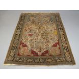 A Qum hunting silk pictorial rug, mid 20th Century, the ivory field depicting horseman pursuing wild