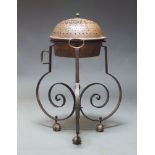 A large French copper coal warmer on wrought iron stand, late 19th, early 20th Century, with pierced