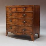 An early 19th Century mahogany bow-fronted chest of drawers, with two short over three long