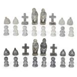 An Inuit stone chess set, c.1990, by Simeonie Aqpik, b.1931, Kimmirut, the kings and queens as