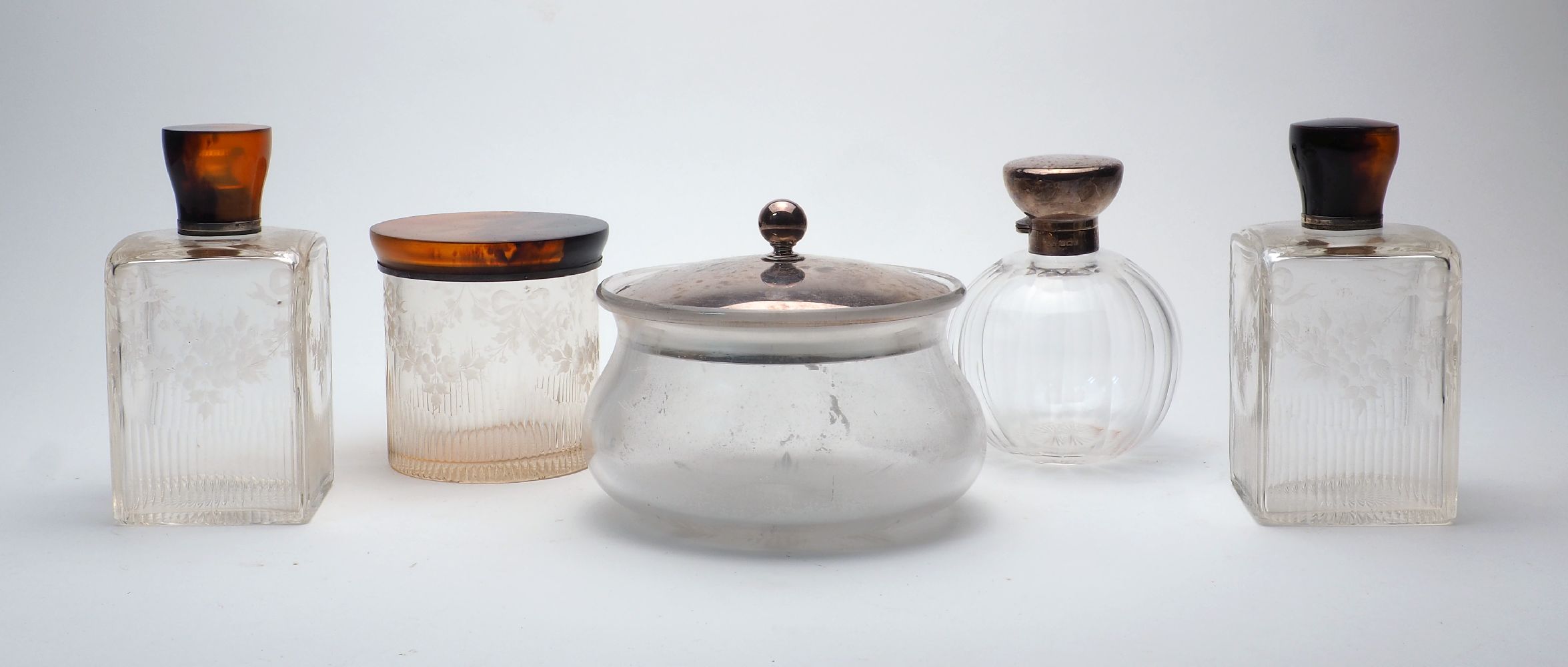 Two silver lidded clear glass jars, 20th Century, to include a rounded jar with fluted body, the lid
