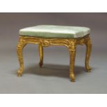 A Loius XV style giltwood carved stool, in the Rococo style, probably late 19th Century, upholstered