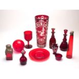 A quantity of cranberry glassware, late 19th to 20th century, pressed and blown examples, to