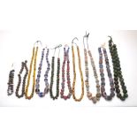 A group of modern Phoenician and Roman style mosaic and marbled glass and carved stone jewellery, to