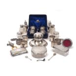 A group of silver comprising: a cased set of four silver salt cellars and two salt spoons, London,