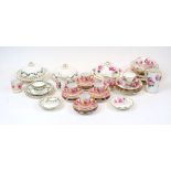 A quantity of British porcelain part tea sets retailed by T. Goode & Co., 20th Century, to