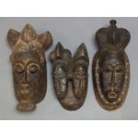 A Baule twin mask, Ivory Coast, second half 20th Century, with carved stylised hair and features,