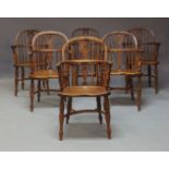 A set of six 19th Century yew, ash and elm Windsor chairs, arched backs, shaped and pierced back