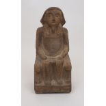 An Egyptian figure, early 20th century, in carved stone, the subject adorned with nemes and faux