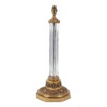 A table lamp, 20th century, of cylindrical form, in cut glass, polished, press-moulded, on bronze