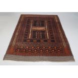 A Turkman rug, incorporating two panels with central arches, deep brown and dark red colour