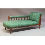 A late Victorian mahogany chaise longue, circa 1890, green foliage pattern upholstered side rest and