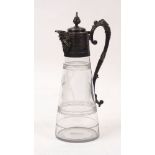 An etched glass ewer designed with silver plated mount and handle, the tapering cylindrical body
