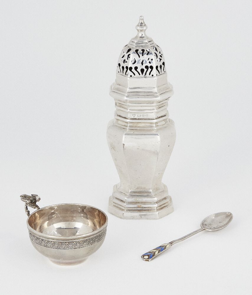 A silver caster, London, c.1933, Harrods, of octagonal form with pierced cap and stepped foot, 16.