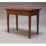 A 19th Century oak tea table, the fold over top above plain frieze on square tapering legs, 72cm