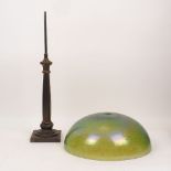A patinated bronze table lamp, 20th century, with an opalescent glass shade, the shaped cluster