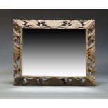 A large carved oak over mantel mirror, late 20th Century, of rectangular form with bevelled mirror