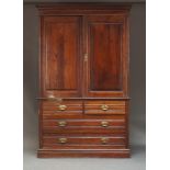 A late Victorian / Edwardian mahogany linen press, the moulded cornice above two panelled cupboard