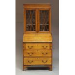 An Edwardian Sheraton Revival mahogany bureau bookcase, circa 1905, of diminutive proportions, the