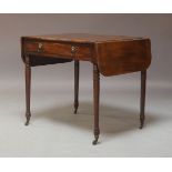 An early 19th Century mahogany Pembroke table, circa 1820, with two drop leaves, fitted with a