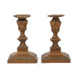 A pair of Neo-Classical brass candlesticks, 19th Century, each with single knopped stem and