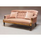 A late Victorian deep button backed upholstered settee, upholstered in pale pink, the arms inlaid