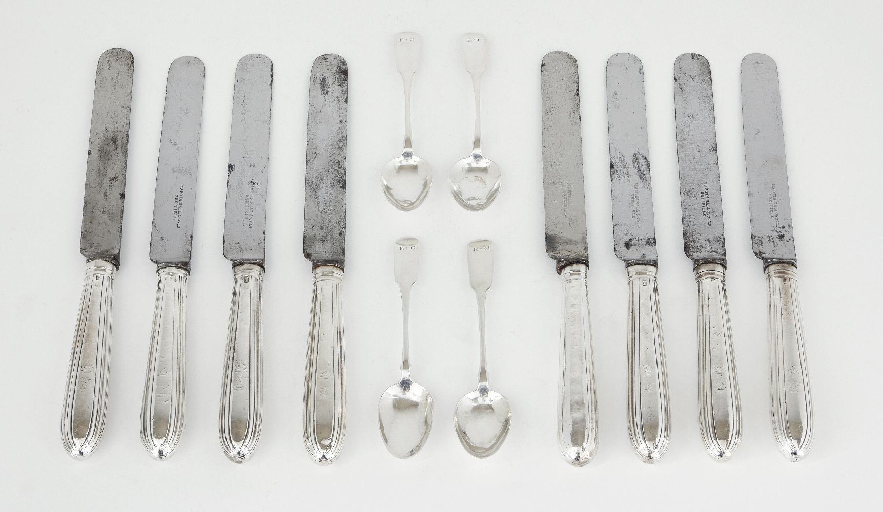 A set of eight silver handled table knives, marks rubbed, maker R.T, with steel blades and