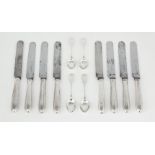 A set of eight silver handled table knives, marks rubbed, maker R.T, with steel blades and