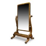 A large Victorian mahogany cheval mirror, the rectangular plate on carved scrolling supports,