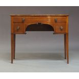 An early 19th Century mahogany bow-fronted dressing table, circa 1840, fitted with four short