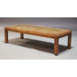 A mahogany and glazed rectangular coffee table, late 20th Century, with glass top over recessed