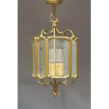 A four light lantern, 20th century, of octagonal form, brass mounted with etched glass panels,